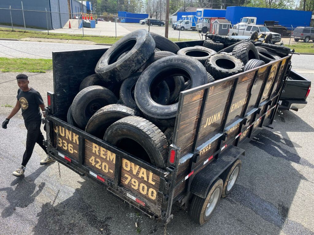 Old tires sitting in the back of a TCC truck
