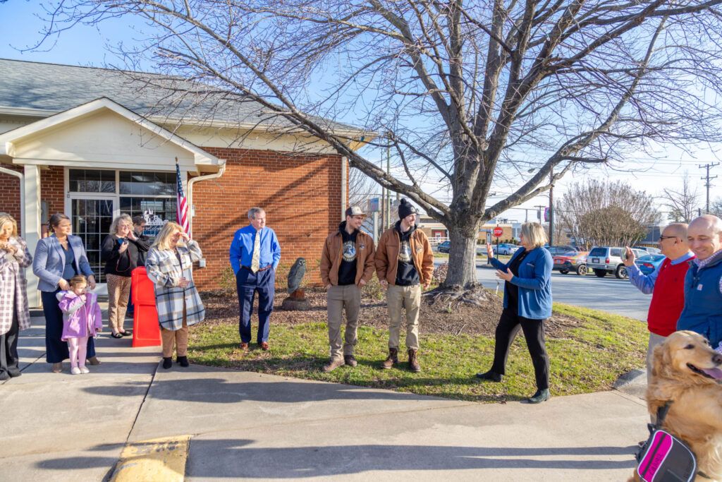 A group of people standing outside