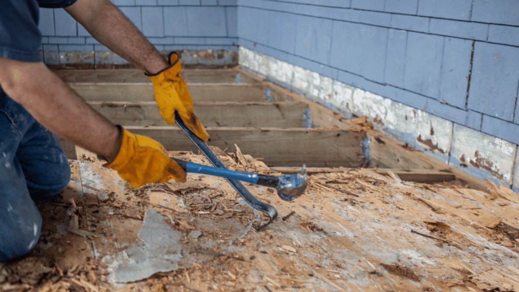 Removing an old wood deck as part of our deck demolition service