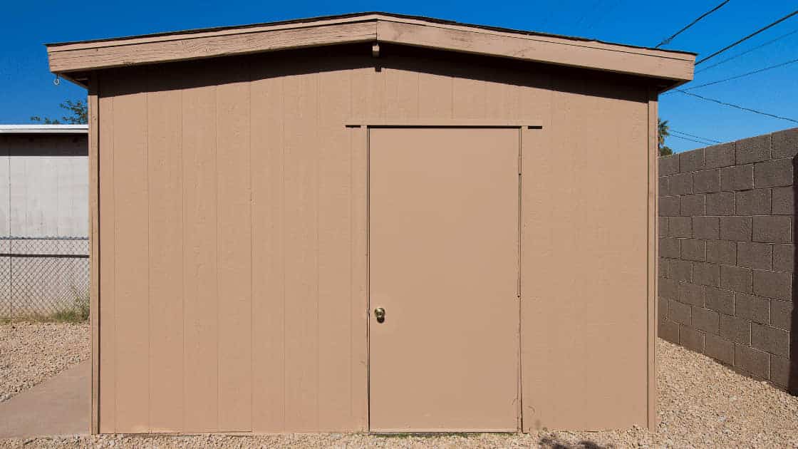 A brown shed with a very clean exterior