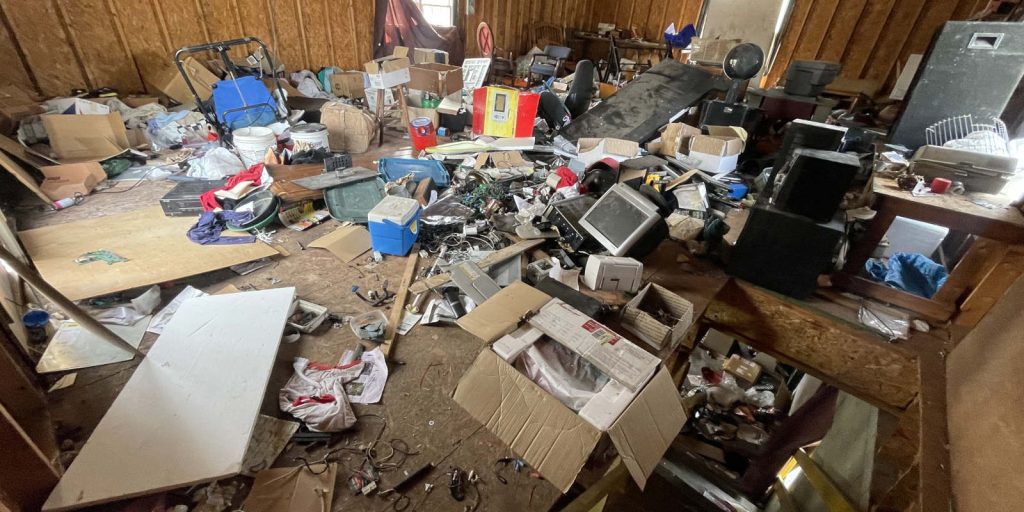 A room filled with junk that needs ot be removed
