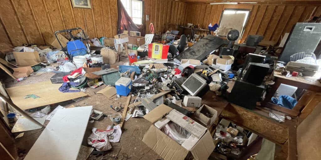 Cluttered room filled with various household items.