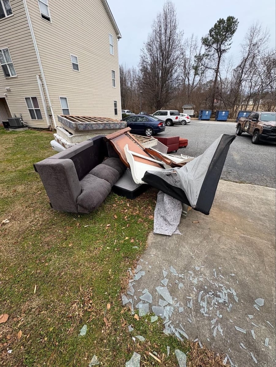 Furniture sitting in front of apartment